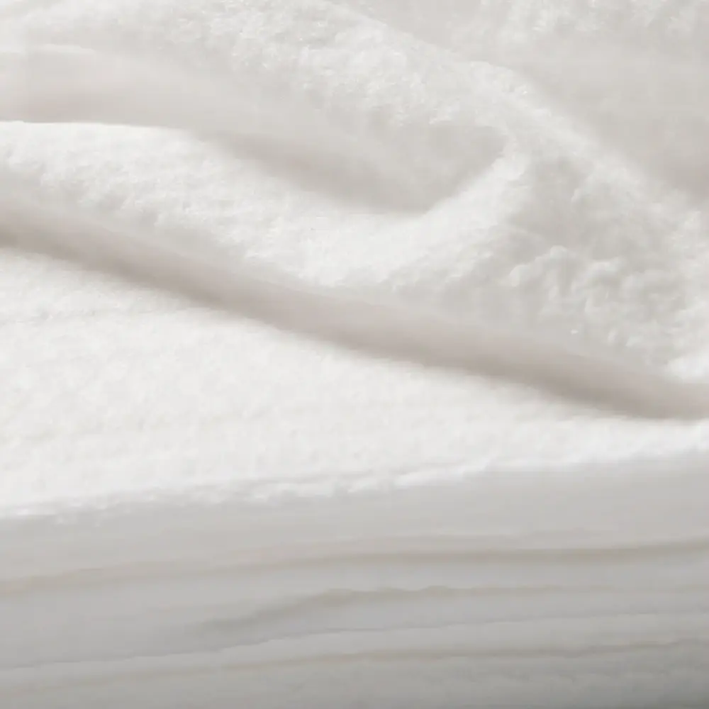 Soft, white fabric texture ideal for bedding or upholstery projects.