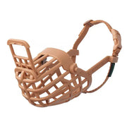 Dog muzzle, lightweight design, adjustable strap, safe for training and vet visits.