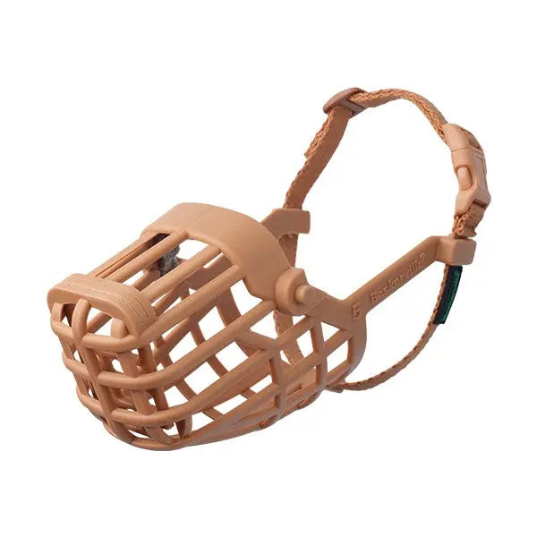 Dog muzzle in beige, designed for safety and comfort during training or vet visits.