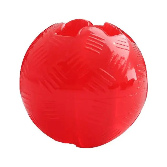 Red rubber ball toy for dogs, designed for interactive play and chewing.