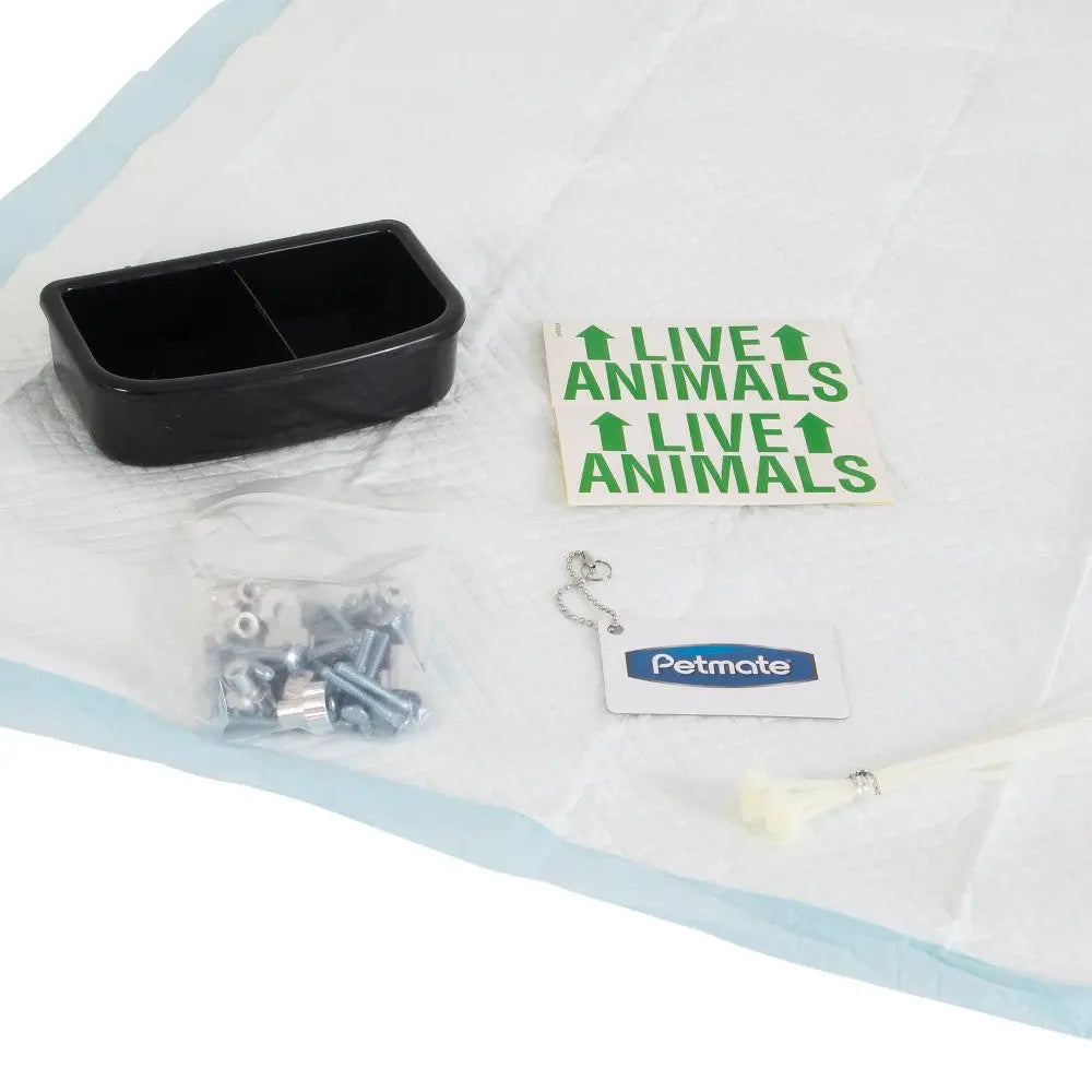 Petmate animal transport kit with feeding bowl, hardware, and live animal labels for safe travel.
