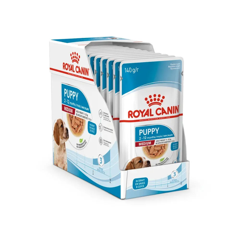 Royal Canin puppy food packaging for medium breeds, featuring 12 pouches of nutritious meals.