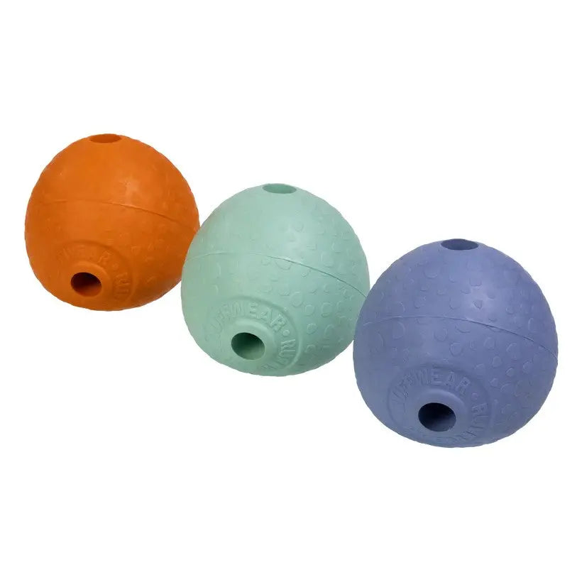 Colorful rubber dog toys in orange, green, and blue for interactive play and chewing.