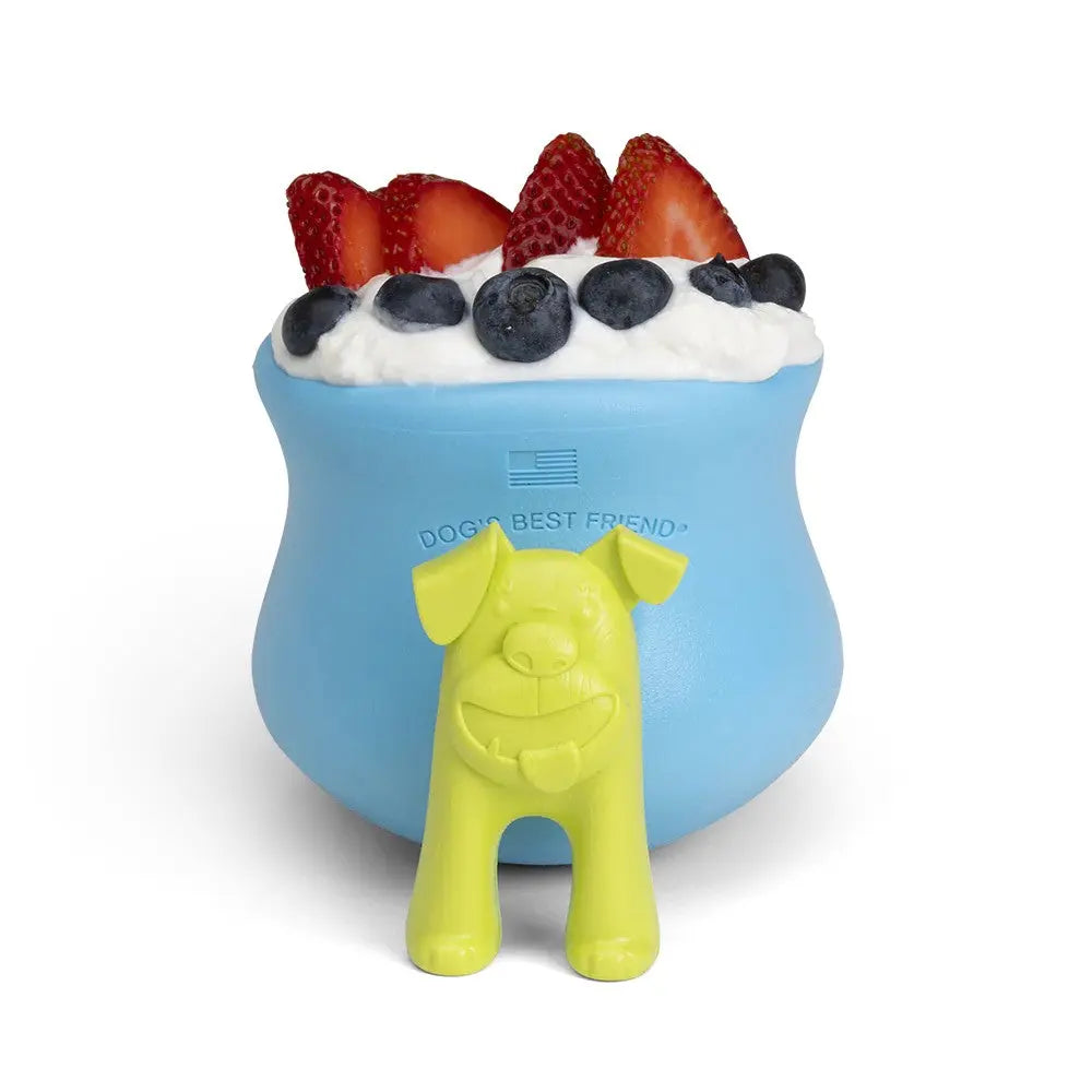 Dog-friendly yogurt bowl with fresh berries and a playful dog-shaped toy.