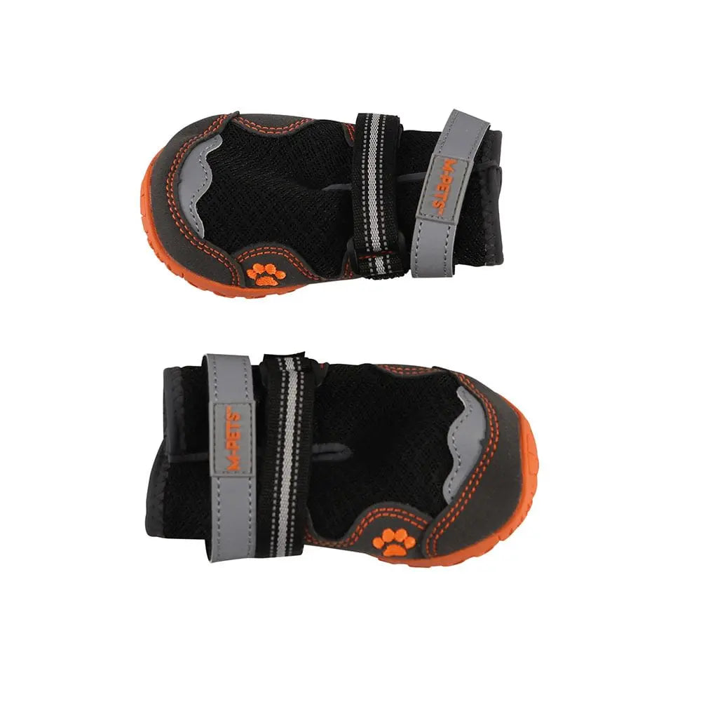 Dog booties with adjustable straps for protection and comfort on outdoor adventures.