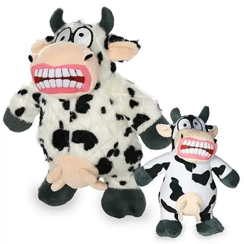Two playful cow plush toys with big smiles and spotted patterns, perfect for kids' imaginative play.