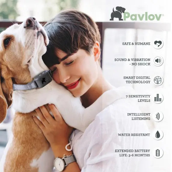 Woman cuddling a dog while showcasing the Pavlov training collar features and benefits.