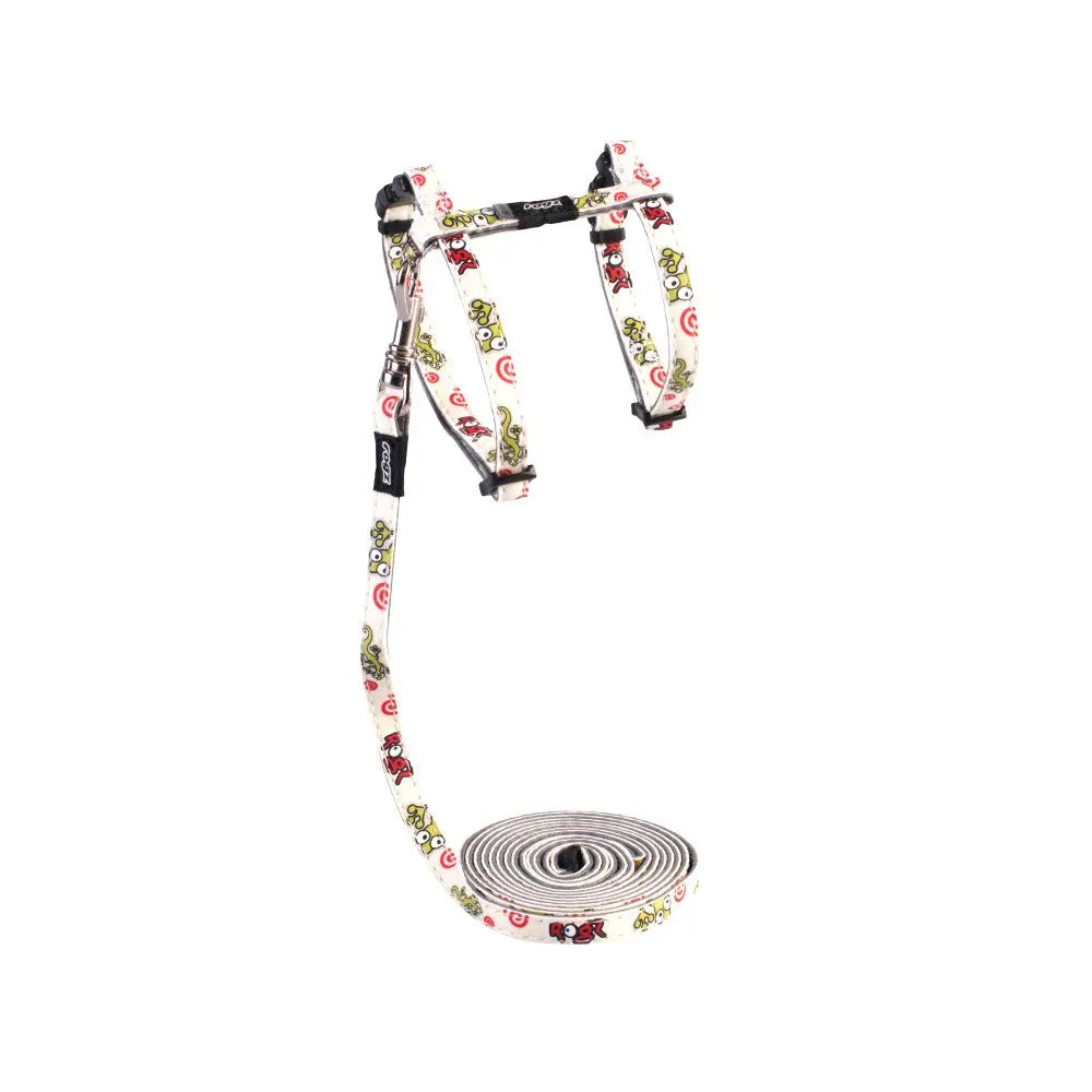 Colorful dog harness and leash set with playful designs for comfortable walks.