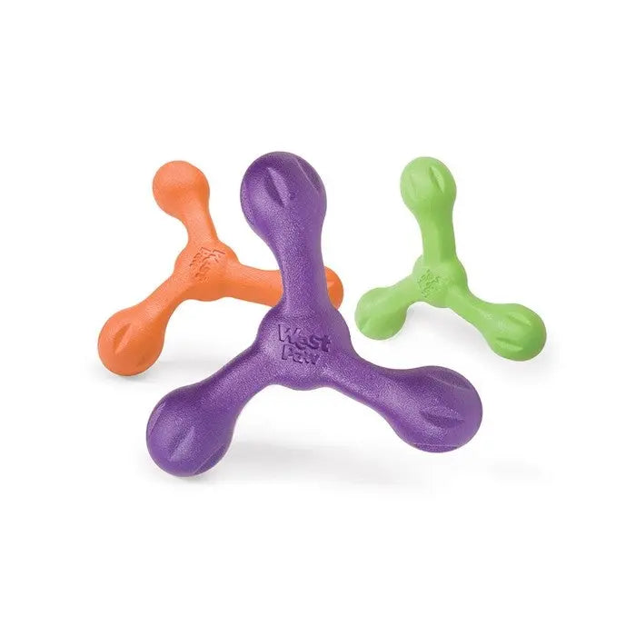 Colorful dog toys in orange, green, and purple, designed for interactive play and chewing.