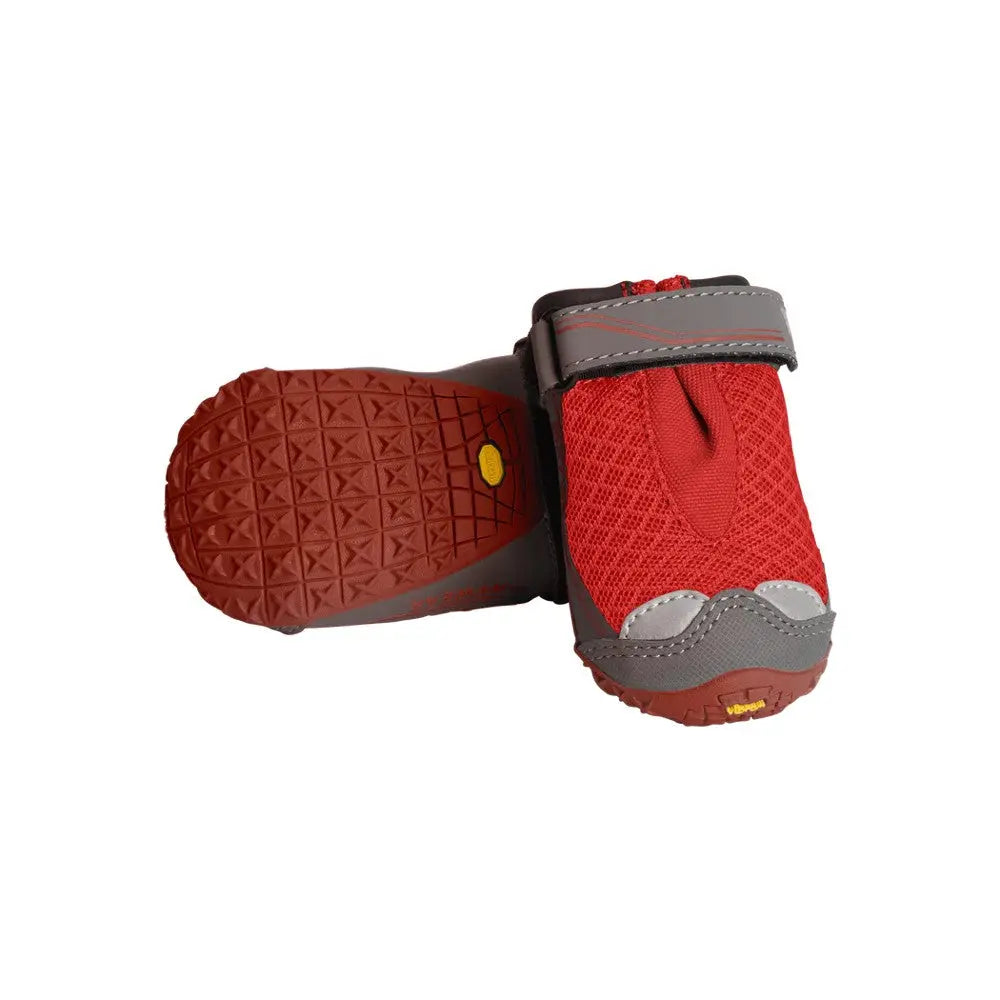 Red dog booties with durable soles for protection and comfort during outdoor activities.
