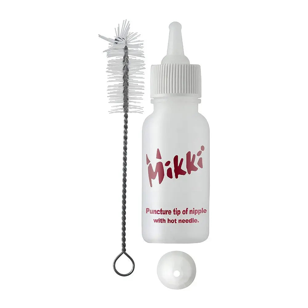Mikki bottle with cleaning brush and nipple tip for easy feeding and maintenance.