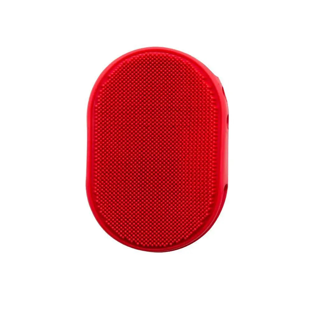 Red silicone pet grooming brush with textured surface for effective fur removal.