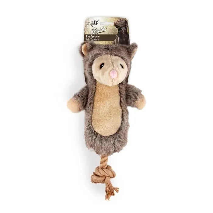 Soft plush dog toy with a rope tail, perfect for interactive play and chewing.