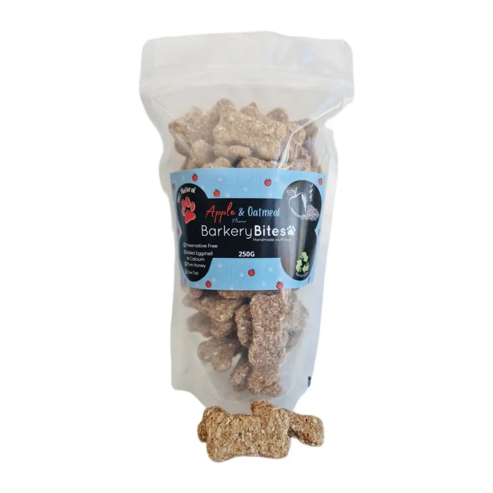Apple and oatmeal dog treats in a clear bag, featuring a fun bone shape and healthy ingredients.