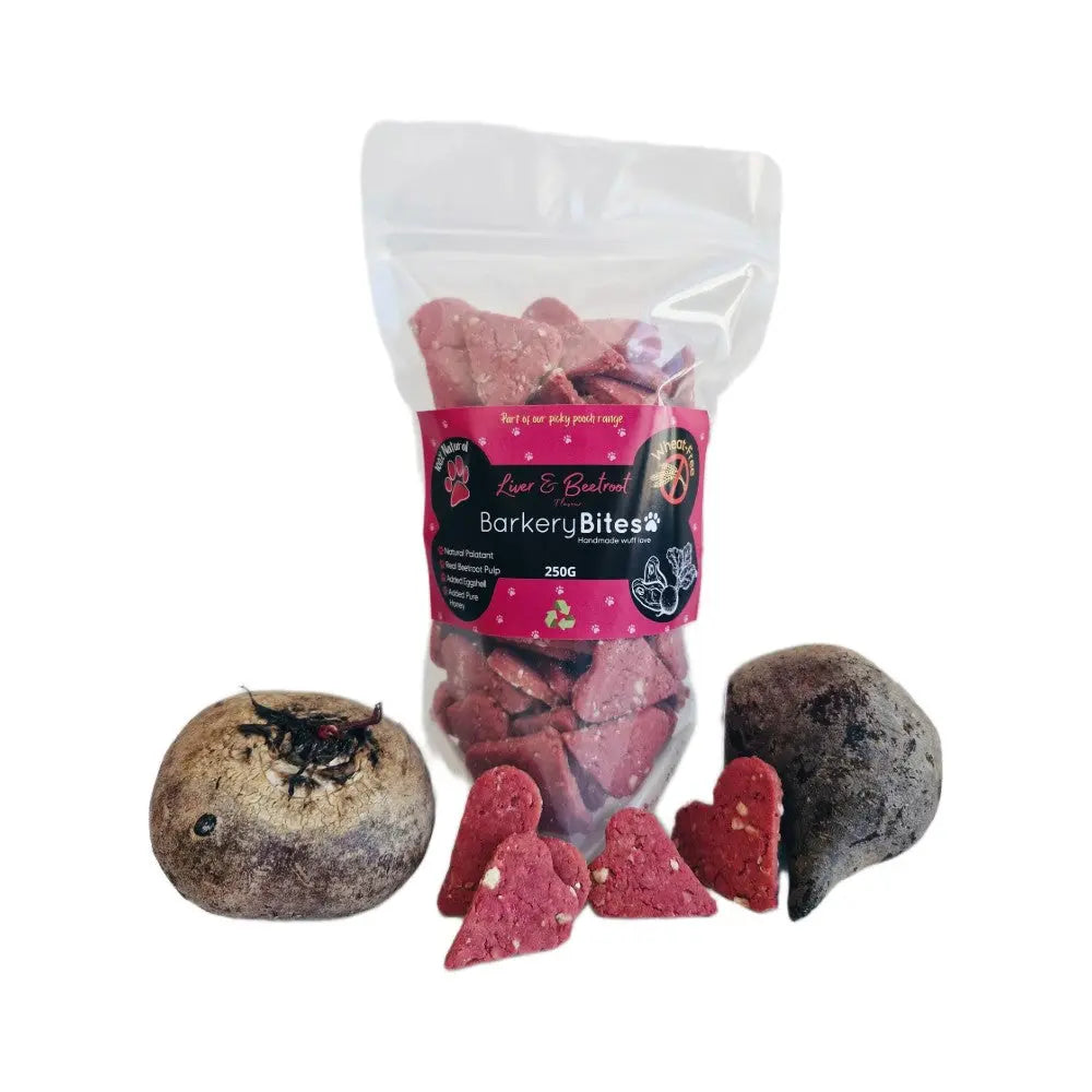 Barkery Bites dog treats in a clear bag with heart-shaped snacks and beetroot pieces for healthy pet indulgence.
