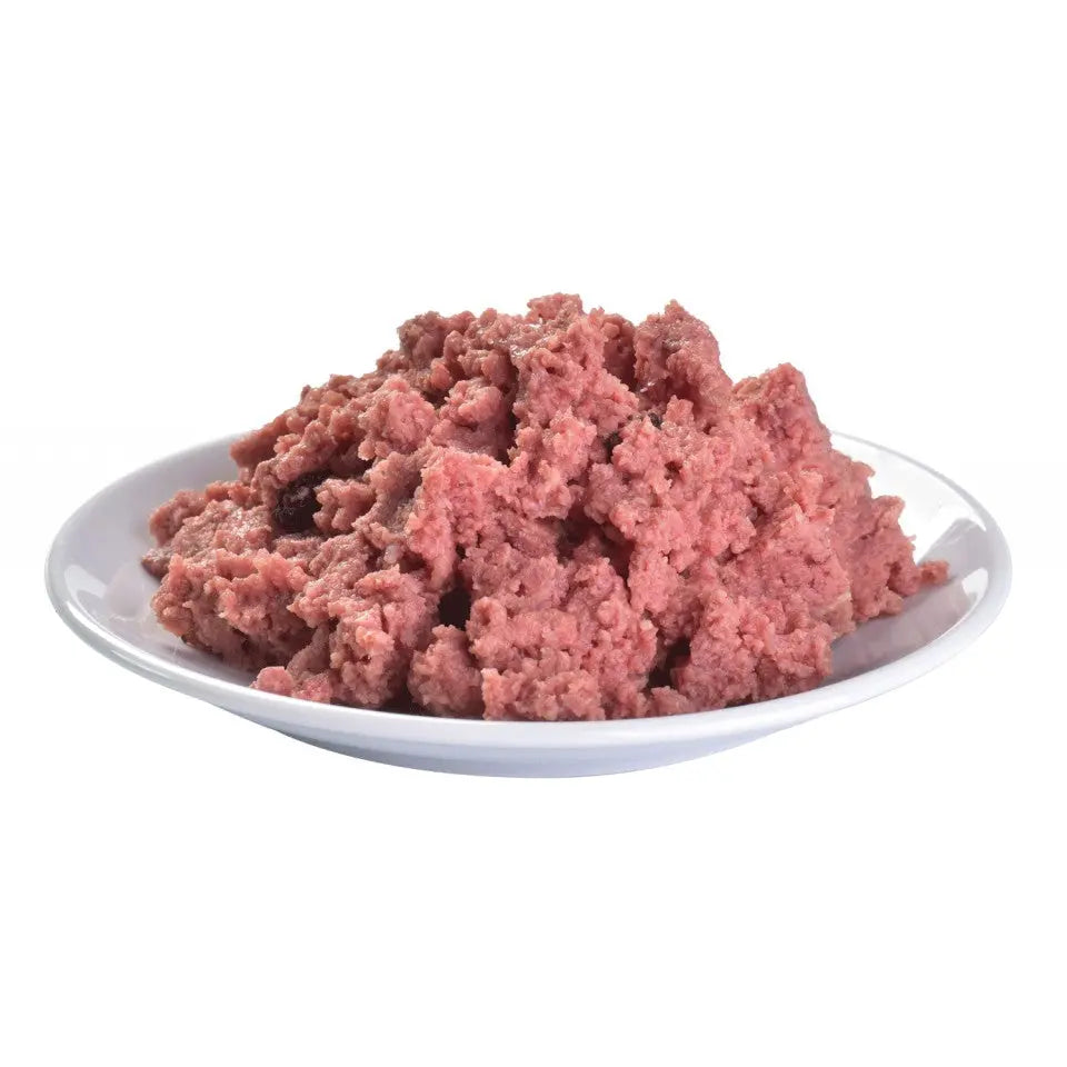Raw ground meat in a white bowl, perfect for homemade pet food recipes.