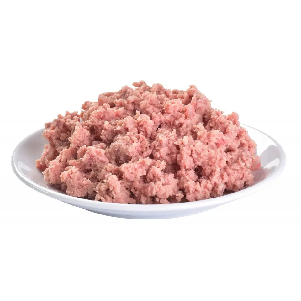 Ground meat on a white plate, perfect for cooking delicious meals or homemade pet food.