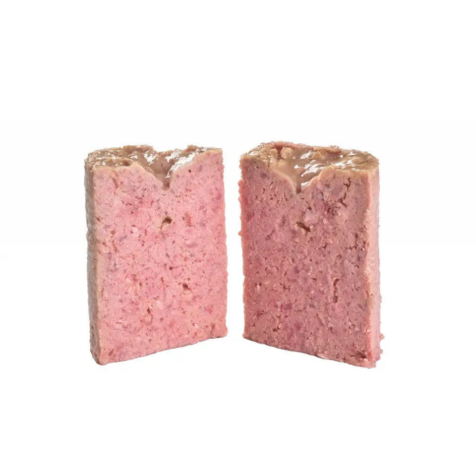 Pink meat pâté cut in half, showcasing smooth texture and rich flavor.