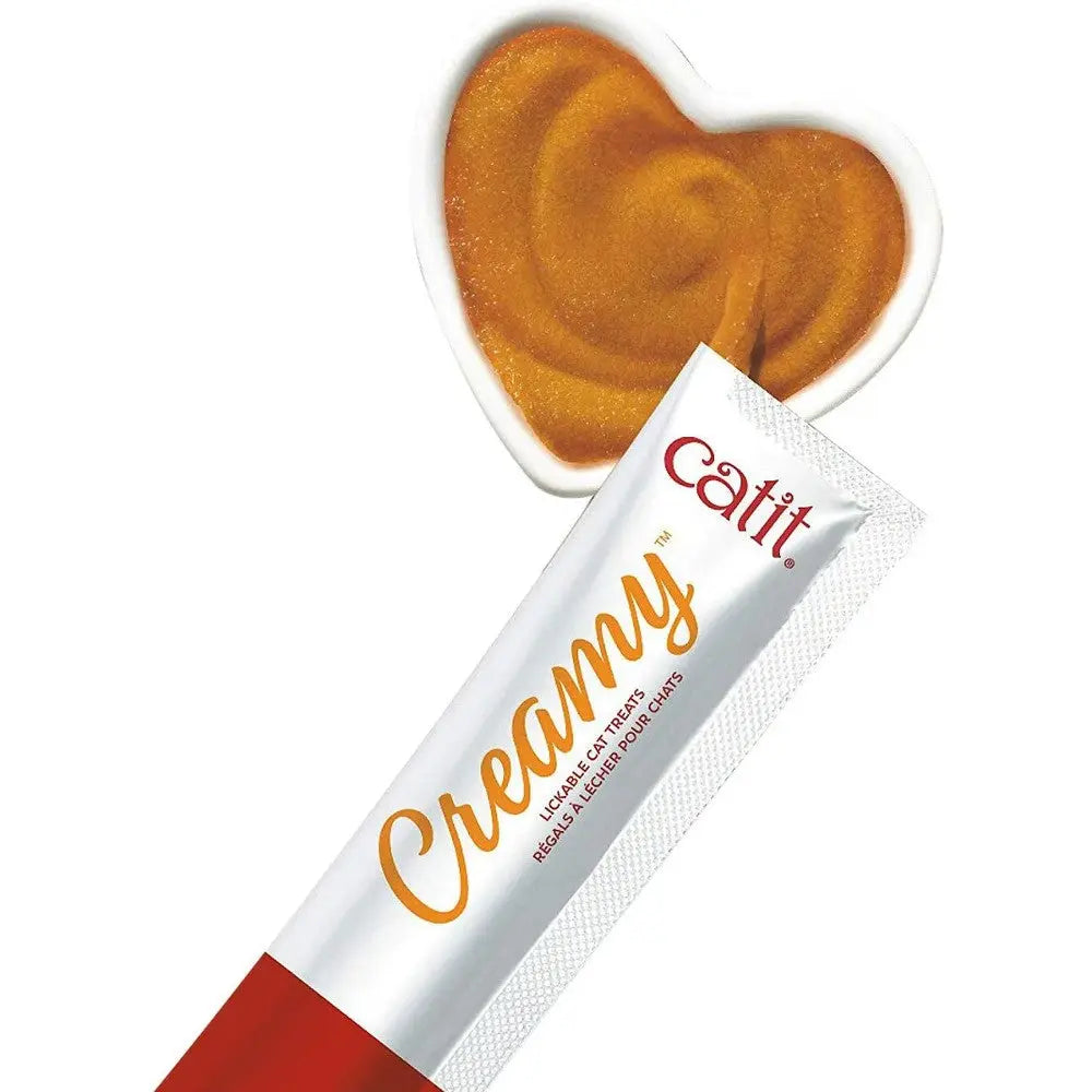 Creamy cat treat in a heart-shaped dish, showcasing delicious flavors for feline enjoyment.