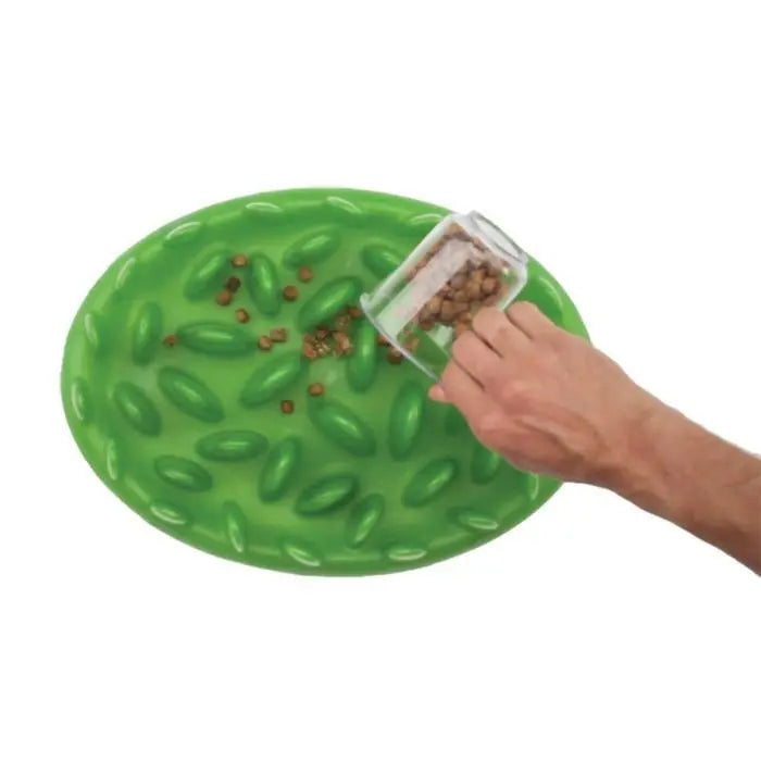 Silicone pet feeding mat with raised design to prevent spills and keep food in place.