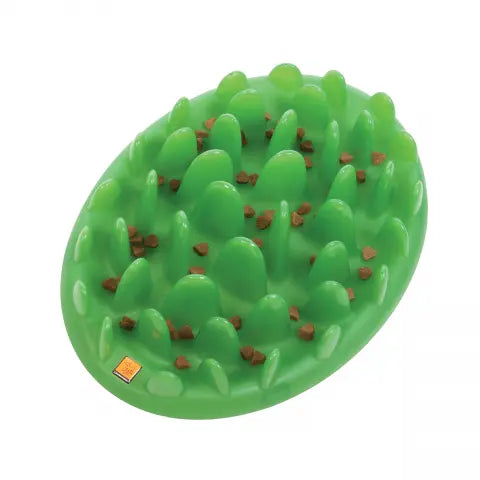 Interactive green pet feeding mat with raised spikes for slow feeding and mental stimulation.