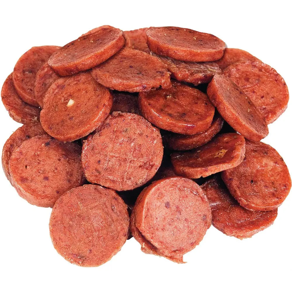 Sliced pepperoni pieces stacked, perfect for pizza toppings or snacking.