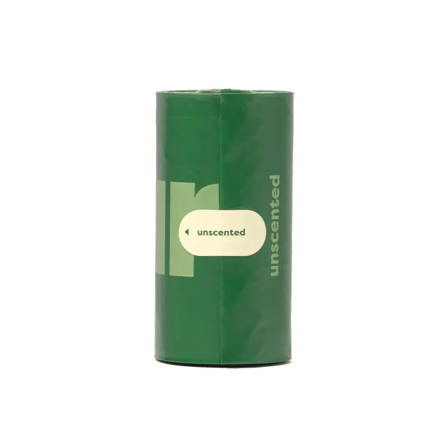 Unscented eco-friendly dog waste bags in a green roll for easy disposal.