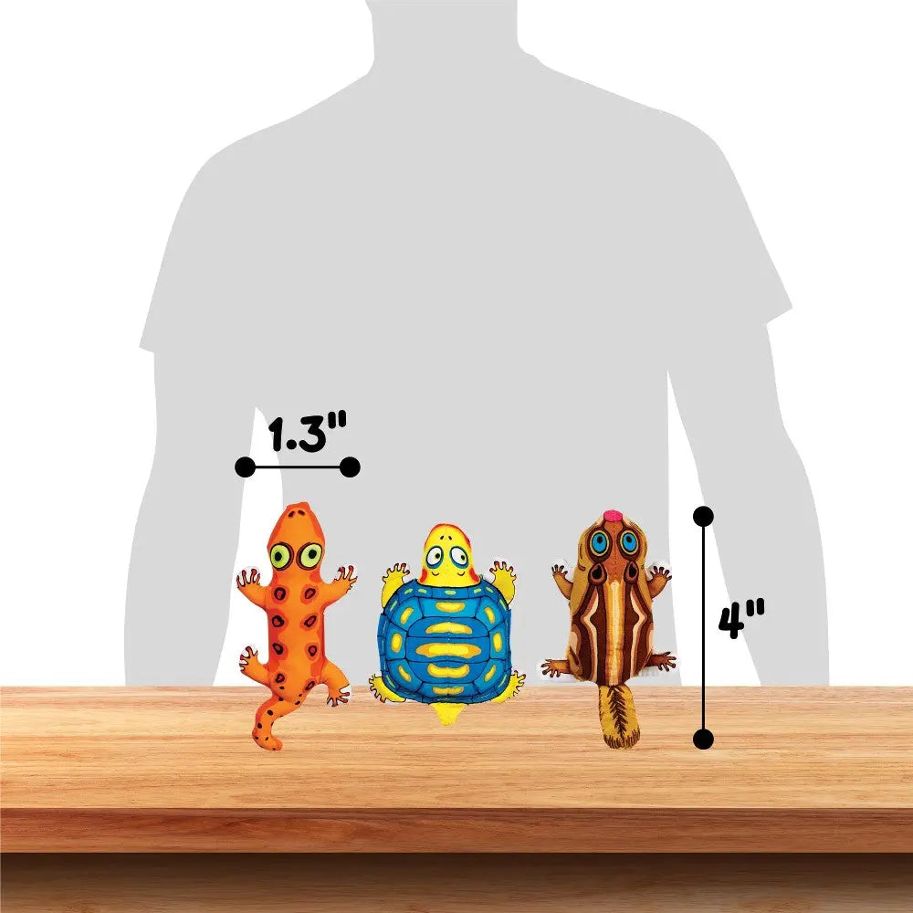 Colorful toy reptiles and amphibians displayed on a wooden surface for size comparison.