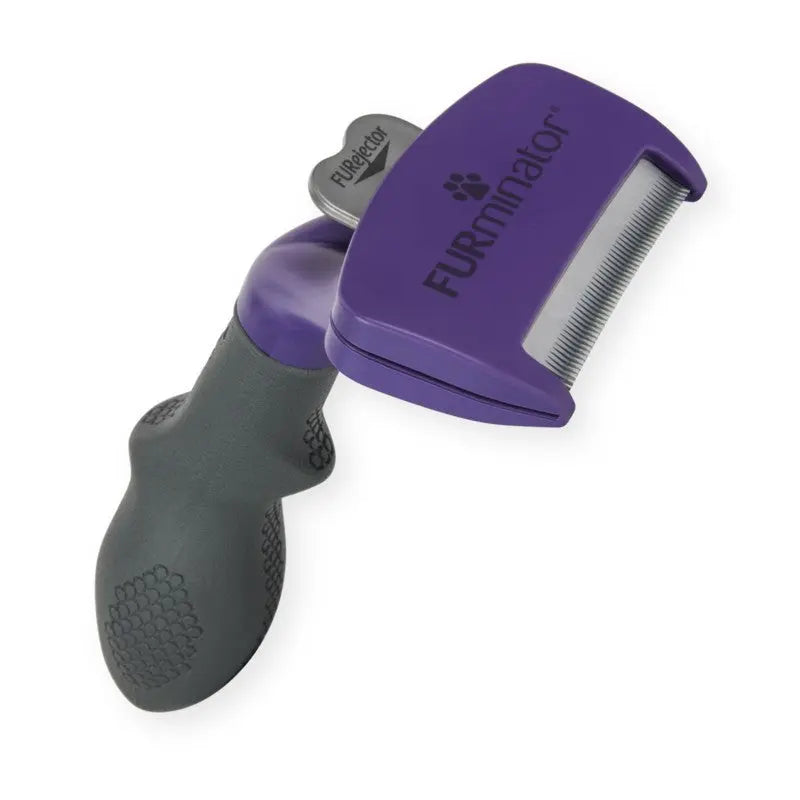 FURminator de-shedding tool for effective pet grooming and fur removal.