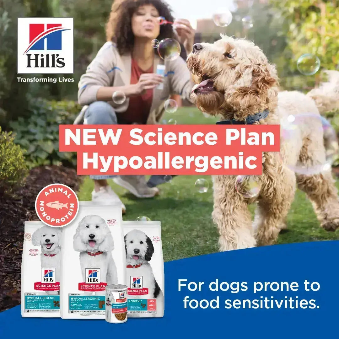 Dog enjoying bubbles in a garden with Hill's Science Plan Hypoallergenic dog food products displayed.