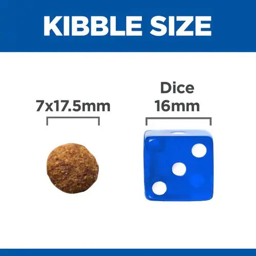 Kibble size comparison with a pet food piece next to a standard dice for scale.