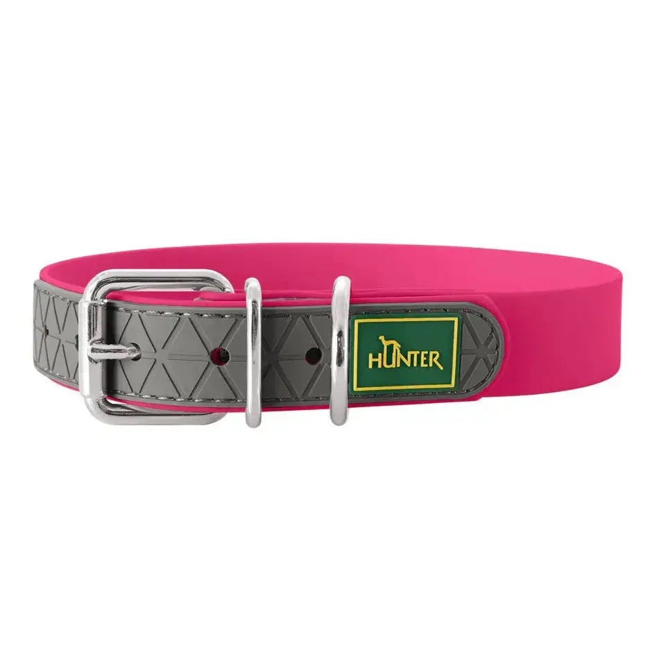 Pink dog collar with a durable buckle and geometric design for stylish pet accessories.