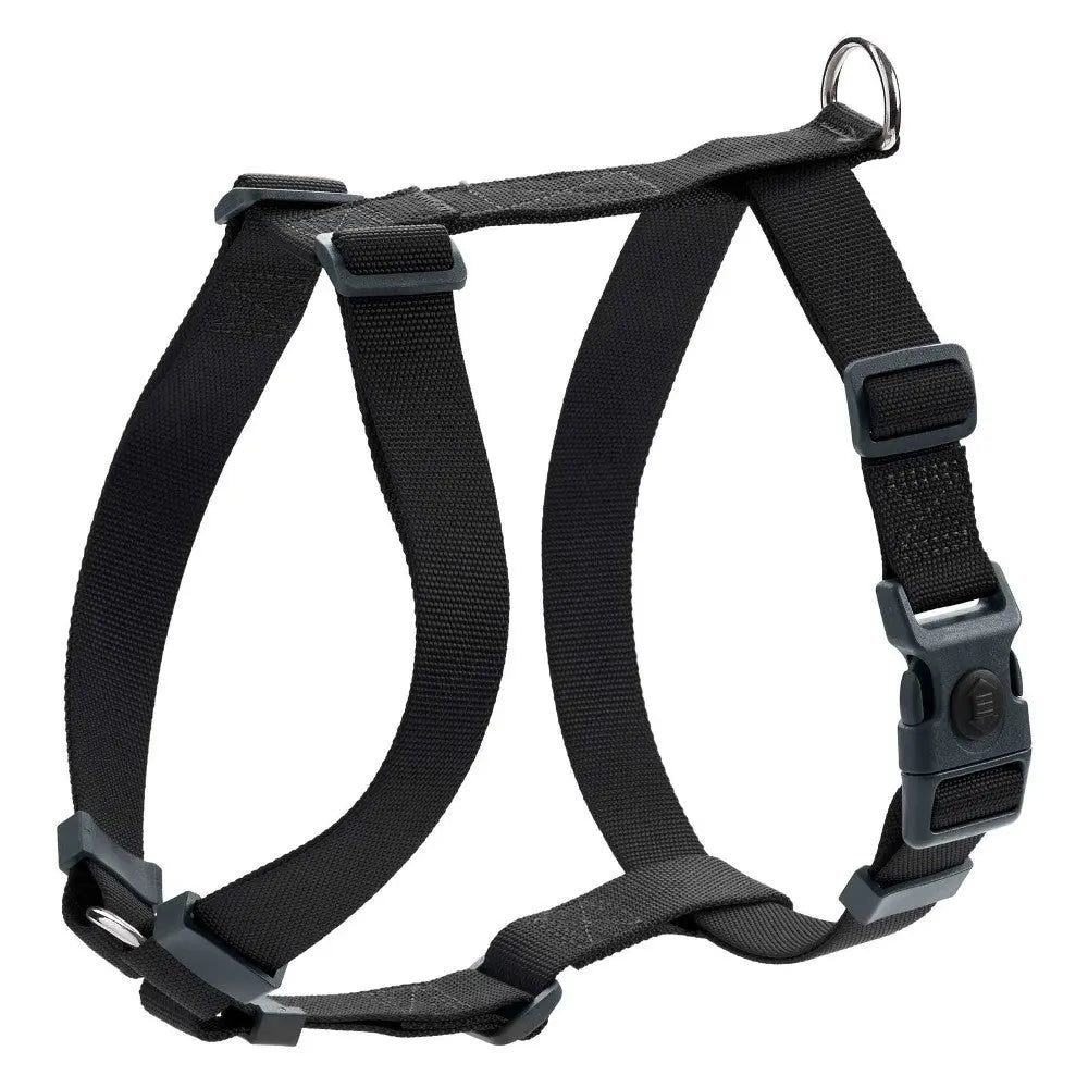 Adjustable black dog harness with sturdy straps and metal D-ring for leash attachment.