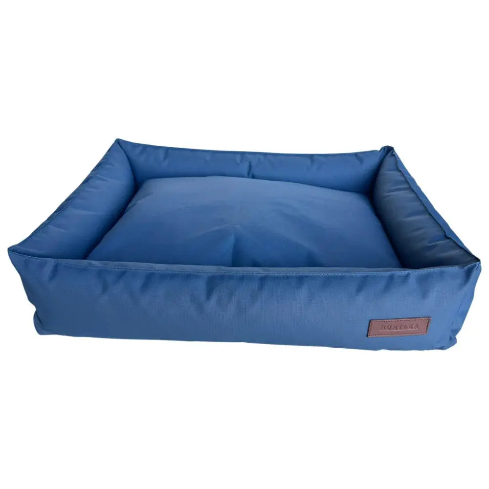 Cozy blue pet bed with soft padding for ultimate comfort and relaxation.