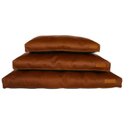 Stacked brown dog beds with a sleek design for comfort and style.