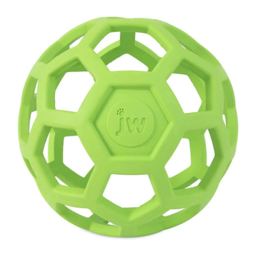 Green rubber dog toy with a honeycomb design for interactive play and chewing.
