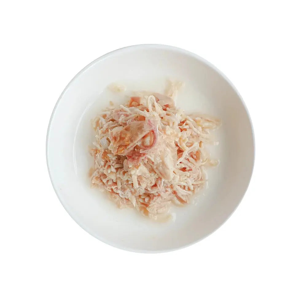 Shredded chicken and rice dish served in a white bowl, perfect for a nutritious meal.