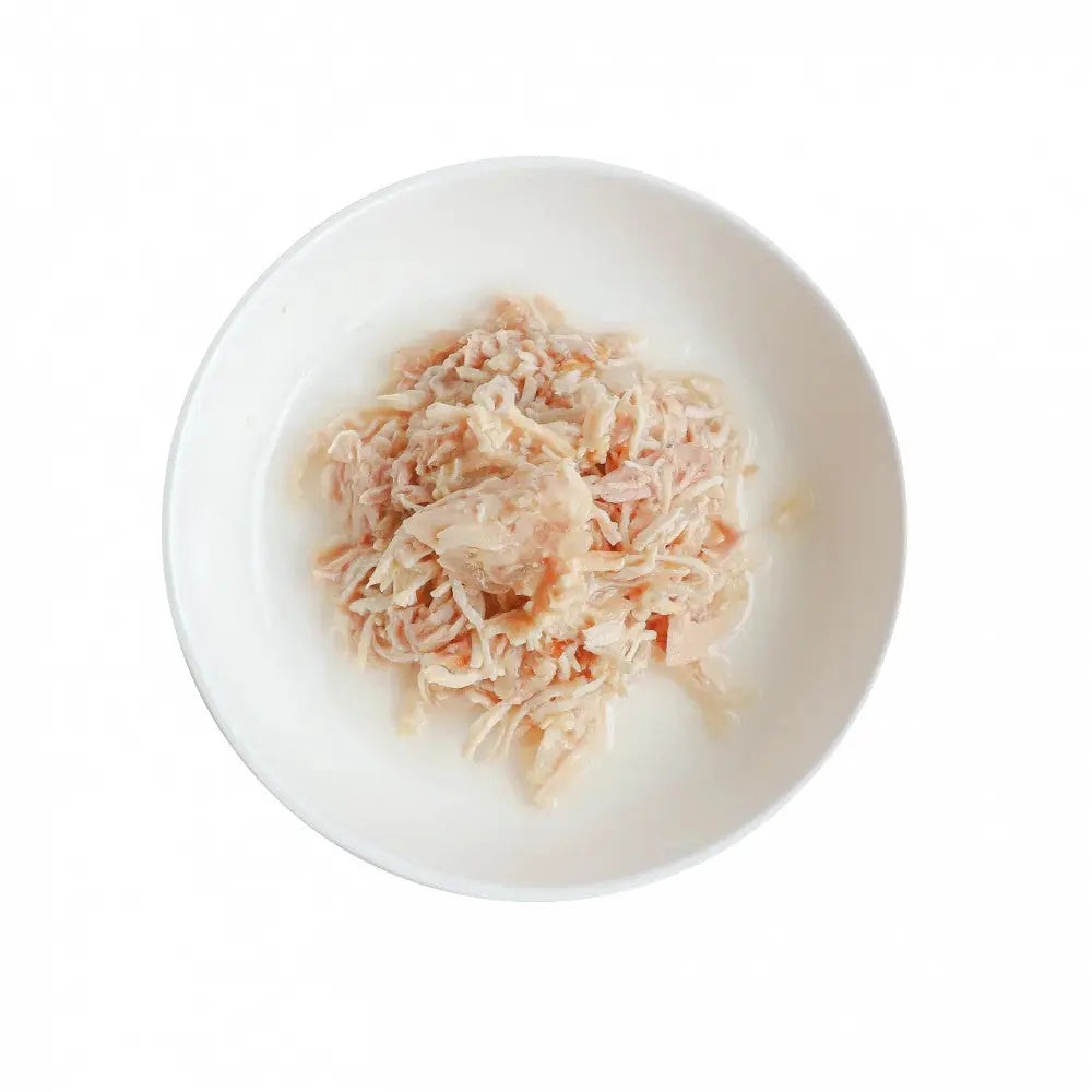 Shredded chicken served in a white bowl, perfect for meal prep or pet food.