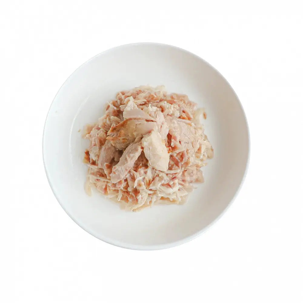 Shredded chicken served in a white bowl, perfect for healthy meal prep or pet food.
