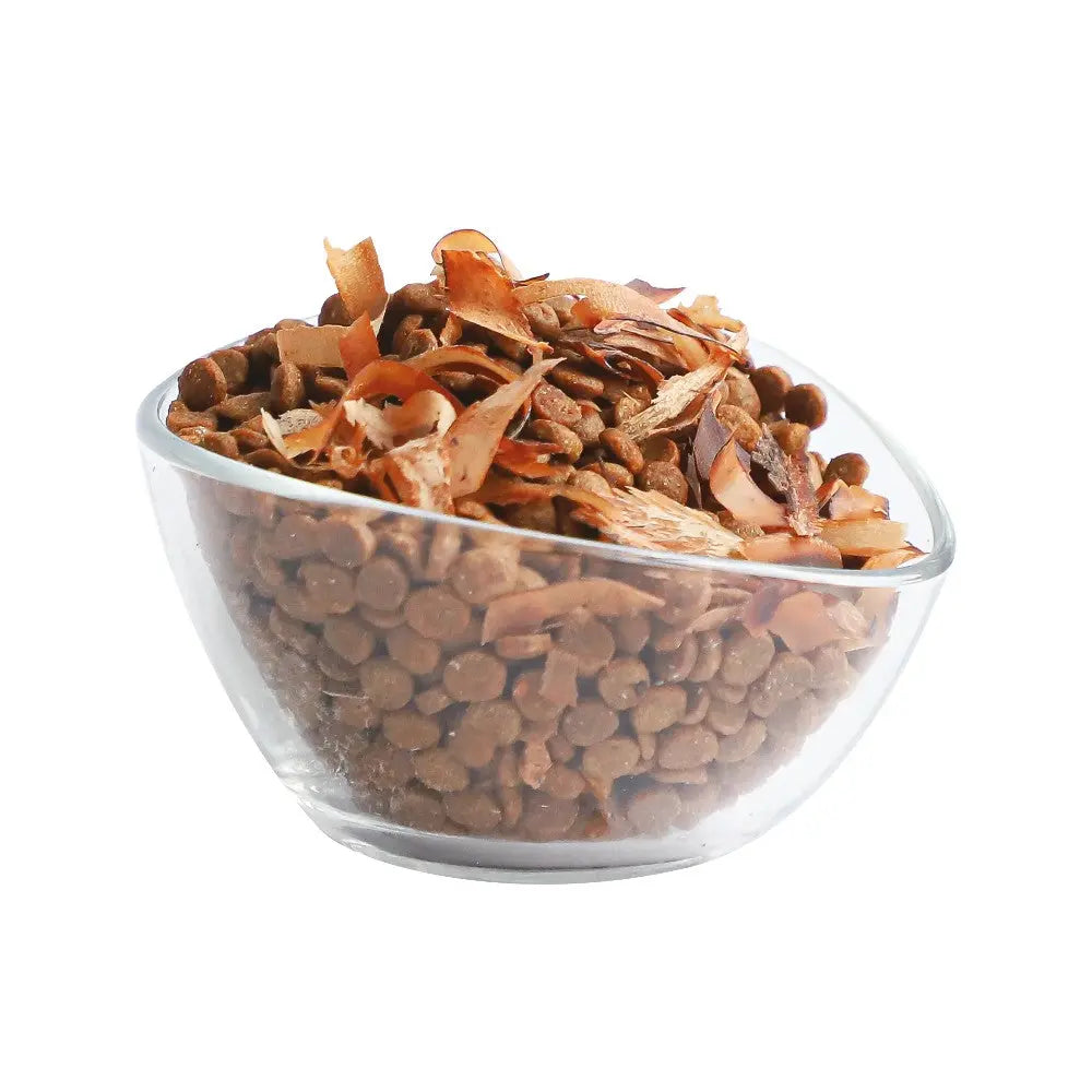 Bowl of nutritious pet food with natural ingredients and coconut flakes.