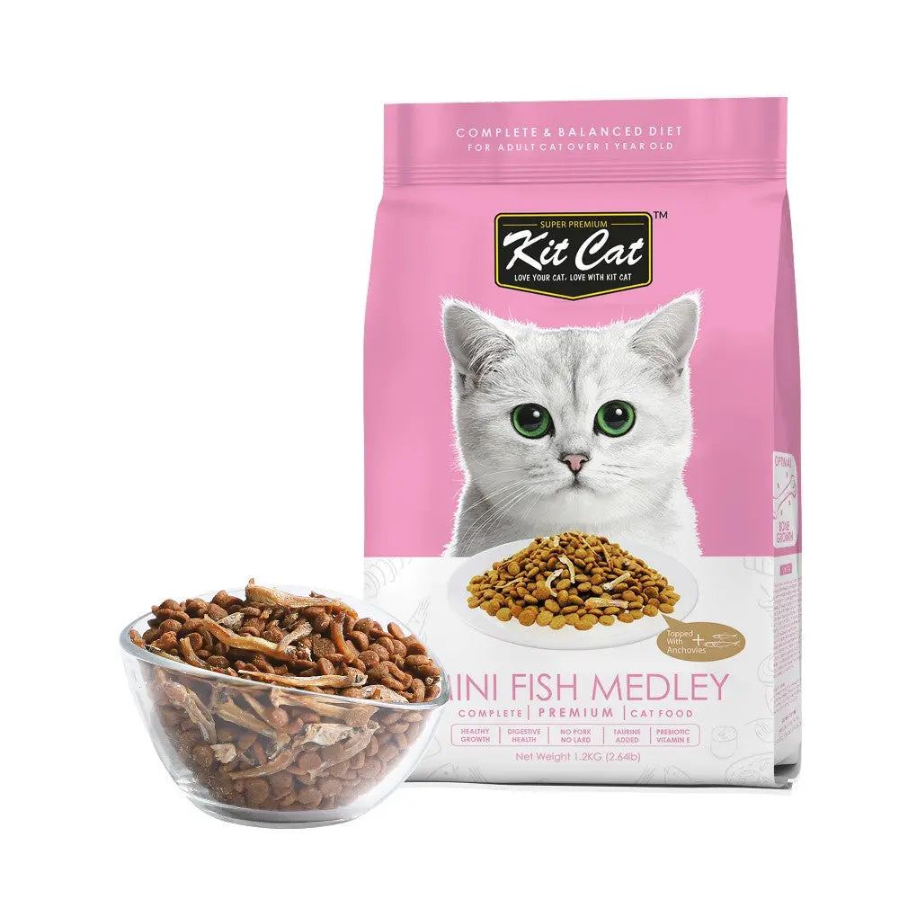 Kit Cat Mini Fish Medley cat food bag with a bowl of kibble, designed for adult cats over 1 year old.