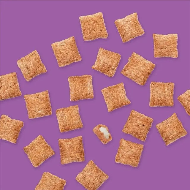 Crispy cereal squares scattered on a vibrant purple background, perfect for breakfast or snacking.