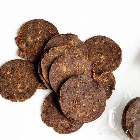 Healthy dog treats, grain-free, round cookies made with natural ingredients for your pet's enjoyment.