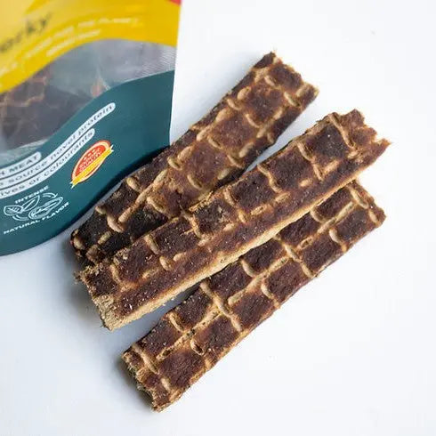 Natural dog treats in a pack, featuring crunchy, textured chews for healthy snacking.