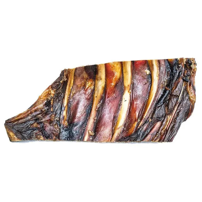 Smoked meat slice showcasing rich colors and textures, perfect for gourmet dishes or charcuterie boards.