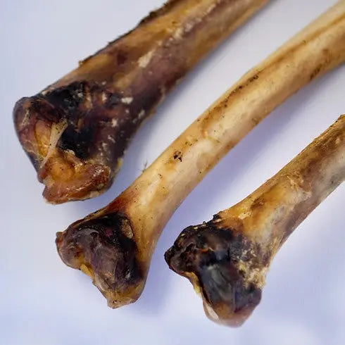 Natural dog bones for chewing, promoting dental health and satisfying canine instincts.