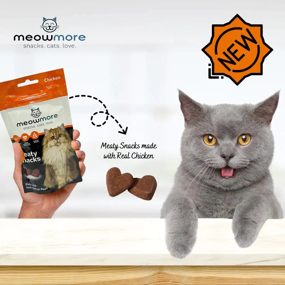 Meowmore chicken snacks for cats, featuring real chicken and a happy gray cat.