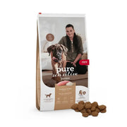 Dog food bag for sensitive stomachs, featuring a happy dog and owner, with natural ingredients.