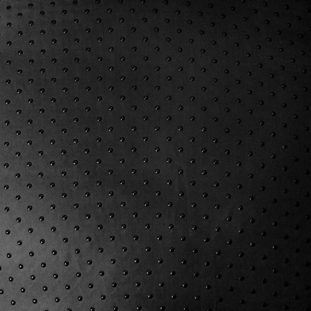 Textured black surface with small raised dots for a modern, stylish look.