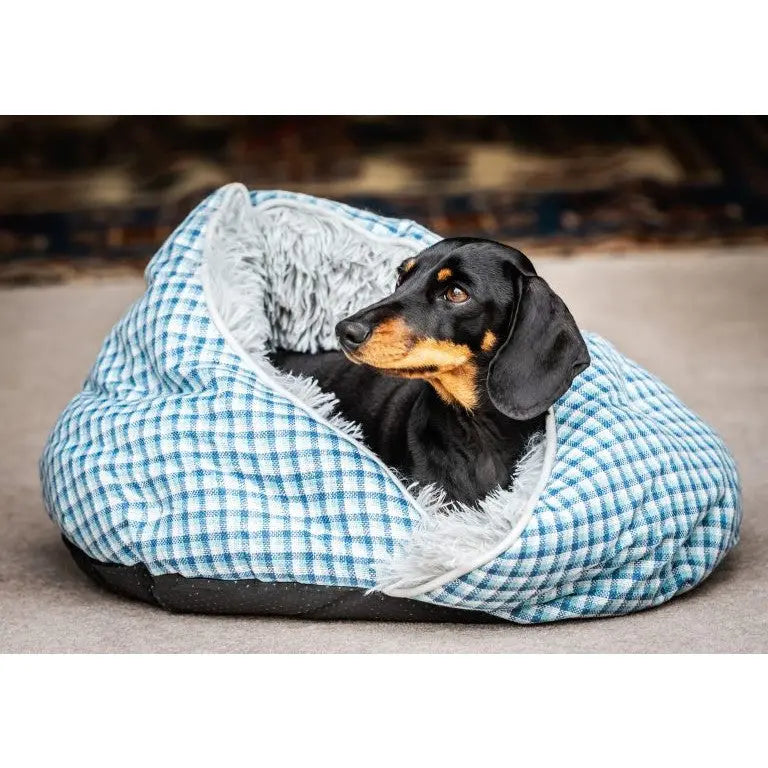 Cozy dog bed with a dachshund resting comfortably inside a soft, plaid design.